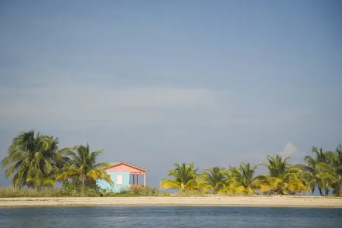Framed Print : Palm trees and house on island with beach in Caribbean Sea, Placencia, Stann Creek District, Belize Framed Print : Palm trees and house on island with beach in Caribbean Sea, Placencia, Stann Creek District, Belize