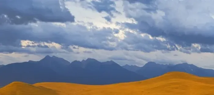 Framed Print : Panoramic view of a stormy evening over the Mission Mountains from the National Bison
