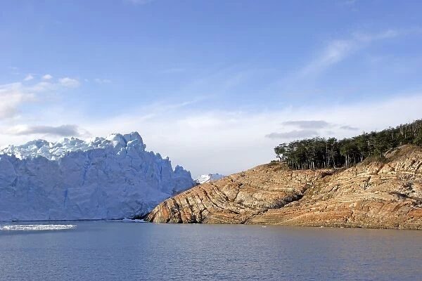 Patagonia Argentina. Brazo Rico lake and red rocks, Perito Moreno glacier front