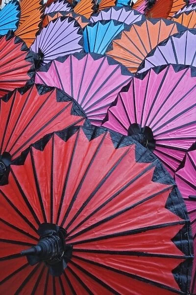 Pattern of newly assembled decorative umbrellas drying in sun, Umbrella Making Center