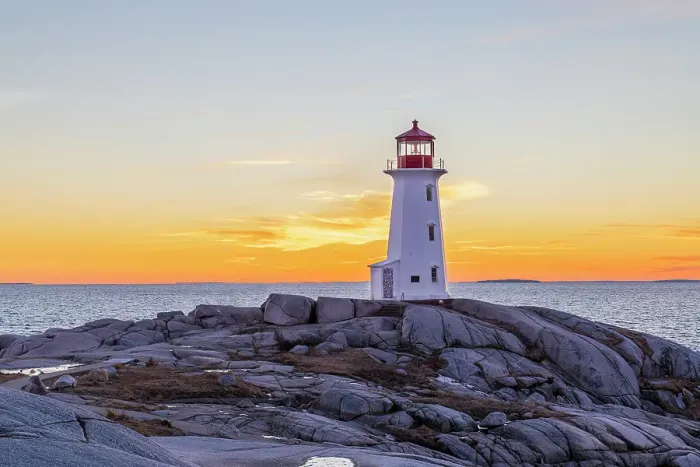 Framed Print : Peggy's Cove Lighthouse in winter at sunset, Nova Scotia, Canada. (Editorial Use Only) Framed Print : Peggy's Cove Lighthouse in winter at sunset, Nova Scotia, Canada. (Editorial Use Only)