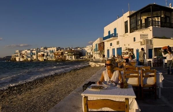 People eating at a restaurant near the beach at Little Venice, Mykonos (MR)