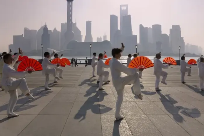 Framed Print : People practicing Taiji with red fans on the Bund in the morning, Pudong skyline Framed Print : People practicing Taiji with red fans on the Bund in the morning, Pudong skyline