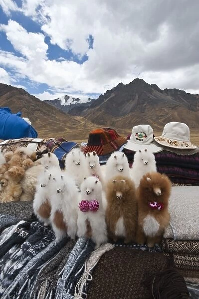 Peru. Feliz Viaje. Local souvenir wool llamas at the Puno les desea feliz viaje pass
