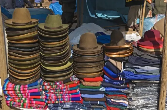 Framed Print : Peru, Pisac, Hats and clothes for sale at market Framed Print : Peru, Pisac, Hats and clothes for sale at market