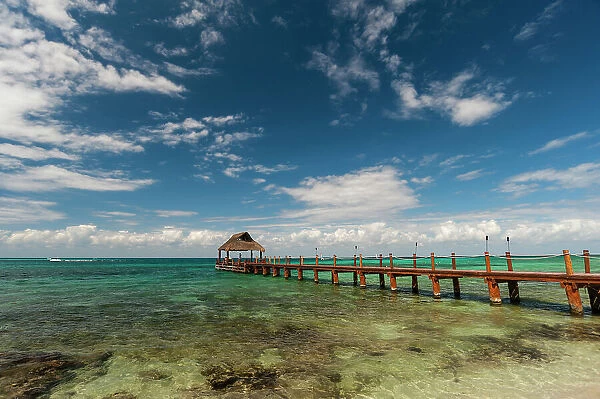 A pier and a palapa on a beach on Cozumel Island, Quintana Roo, Mexico
