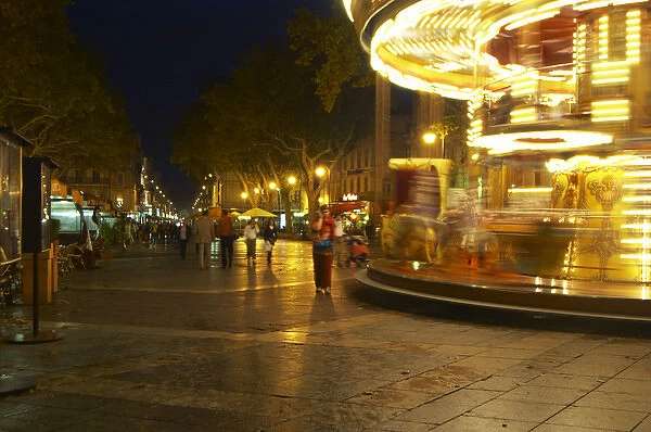 The place de l Horloge main town square in Avignon at night with a merry-go-round