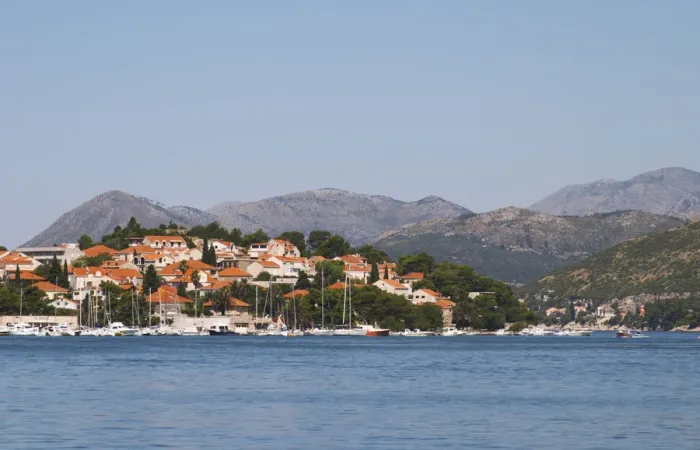 Framed Print : Pleasure boats moored on buoys and along the key. Mountain tops in the background Framed Print : Pleasure boats moored on buoys and along the key. Mountain tops in the background