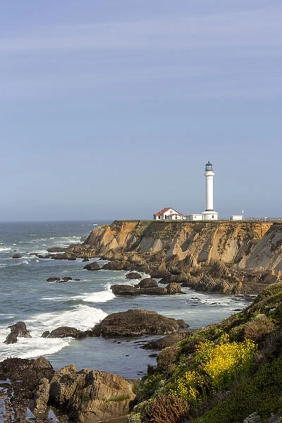 Point Arena lighthouse on cliffs over the Pacific Ocean near Point Arena, California, USA