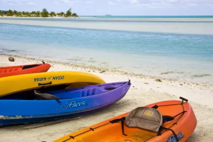 Framed Print : Polynesia, Cook Islands, Aitutaki. Colorful kayaks on the beach