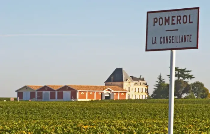 Framed Print : Pomerol vineyards - A sign with La Conseillante, with the chateau Evangile with winery