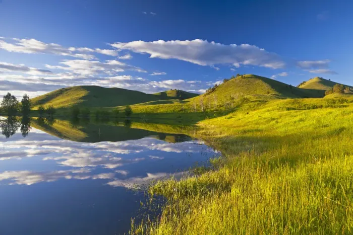 Framed Print : Pond reflects at days end in the Bears Paw Mountains near Havre, Montana, USA Framed Print : Pond reflects at days end in the Bears Paw Mountains near Havre, Montana, USA
