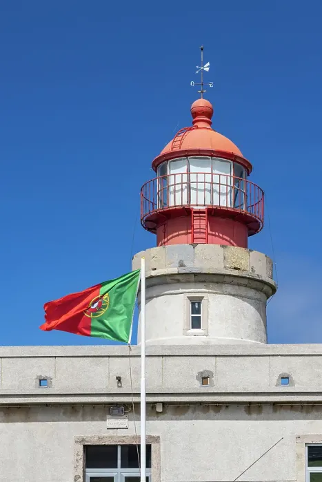 Framed Print : Ponta Delgada, Azores, Portugal. Portuguese flag and Albarnaz Lighthouse on Flores Island