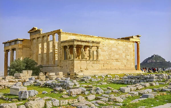Porch Caryatids and ruins. Temple of Erechtheion, Athens, Greece. Columns of Greek maidens