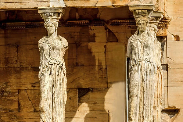 Porch Caryatids and ruins. Temple of Erechtheion, Athens, Greece. Columns of Greek maidens