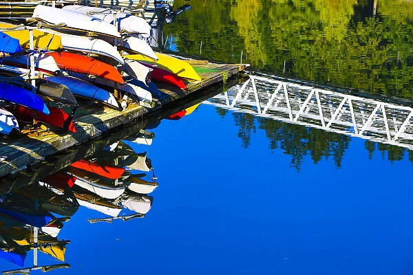 Port Ludlow Marina, Washington. Colorful kayaks and a white bridge on the dock