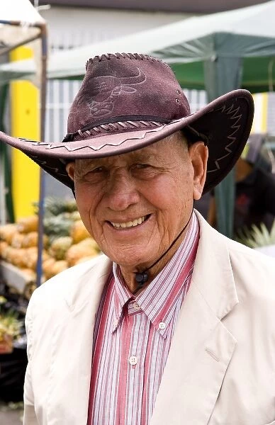 Portrait of smiling local man in Central Market with fruits and vegetables in Pavas