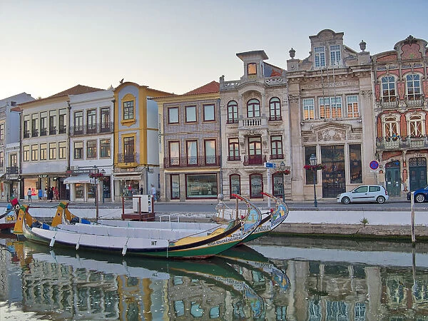 Portugal, Aveiro. Moliceiro boats along the main canal of Aveiro
