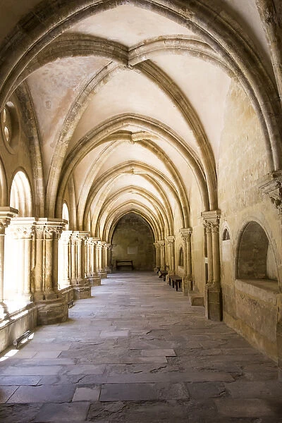 Portugal, Coimbra. Old Cathedral cloister. Archways, walking paths, courtyard