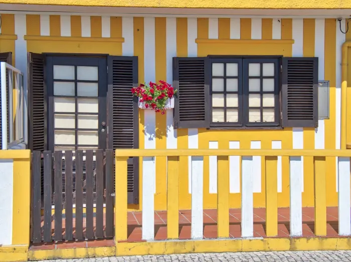Framed Print : Portugal, Costa Nova. Colorful houses Palheiros striped homes