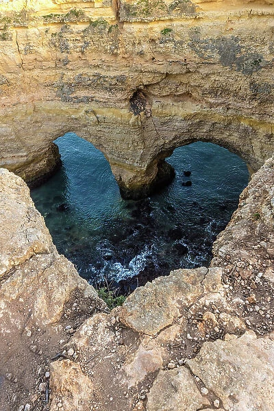 Portugal. Heart-shaped rock design on shore