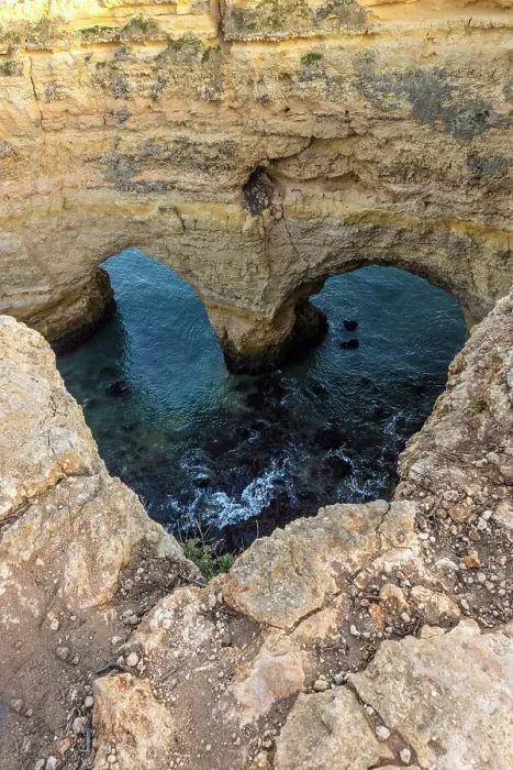 Framed Print : Portugal. Heart-shaped rock design on shore