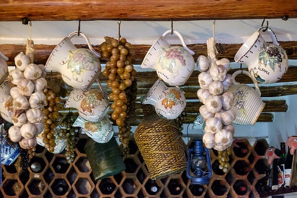 Portugal, Lisbon. Ceiling decor and wine bottles. Parreirinha de Alfama Restaurant