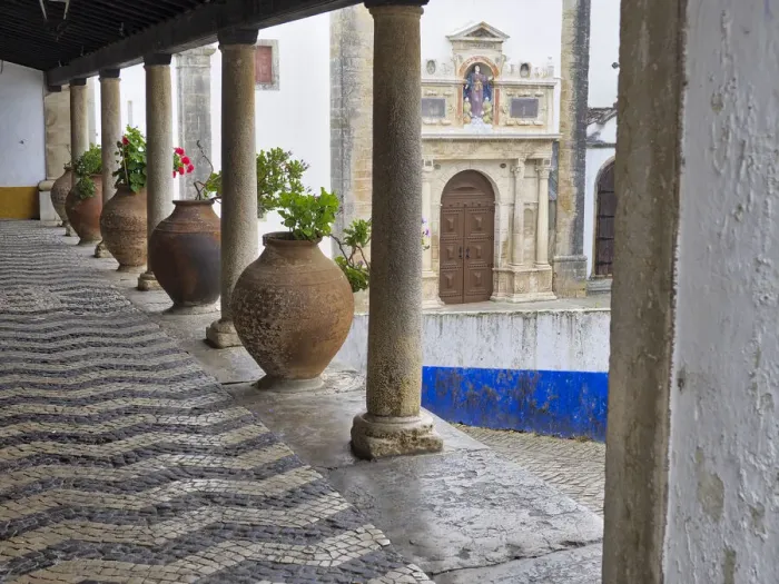 Framed Print : Portugal, Obidos. Ceramic pots adorning a building ledge