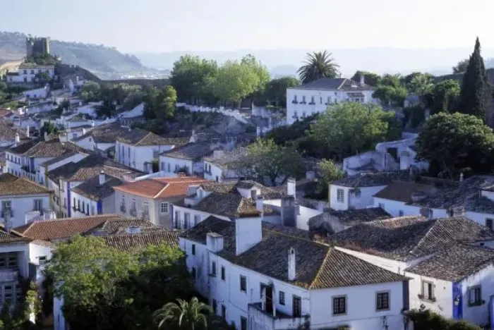 Framed Print : Portugal, Obidos. Elevated view of whitewashed houses and 14th century crenellated walls of castle Framed Print : Portugal, Obidos. Elevated view of whitewashed houses and 14th century crenellated walls of castle