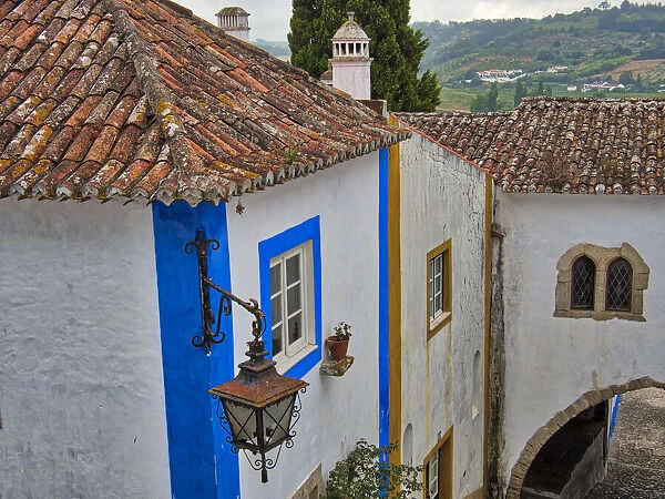 Portugal, Obidos. Graphic buildings inside the White walled town
