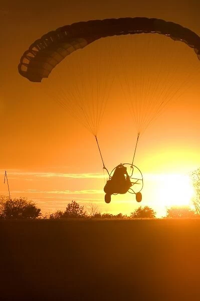 Powered parachute flying at sunset in Eation County, Michigan