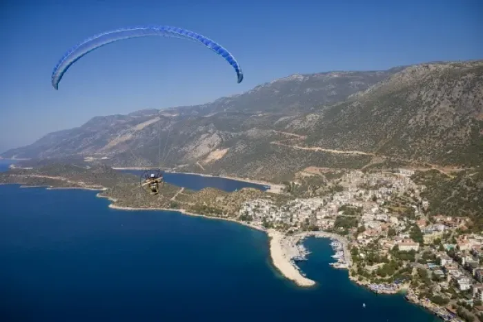 Framed Print : Powered paraglider flying over Kas, aerial view, Antalya, Turkey Framed Print : Powered paraglider flying over Kas, aerial view, Antalya, Turkey