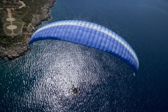 Framed Print : Powered paraglider flying over Kas, aerial view, Antalya, Turkey Framed Print : Powered paraglider flying over Kas, aerial view, Antalya, Turkey