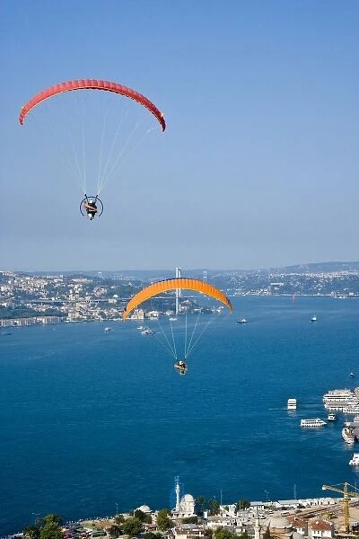 Two powered paragliders flying over Uskudar, aerial view, Bosphorus and the European