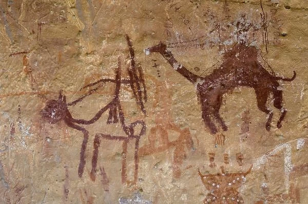 Prehistoric rock paintings with camels and hunters, Akakus, Sahara desert, Fezzan, Libya