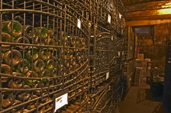 Framed Print : The private bottle aging cellar with hundreds, thousands of bottles in metal wrought