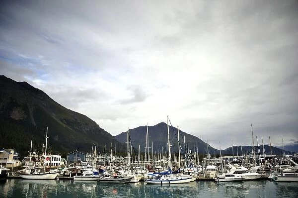 Private and Commercial Boats lie in Seward harbor amongst breaking skies