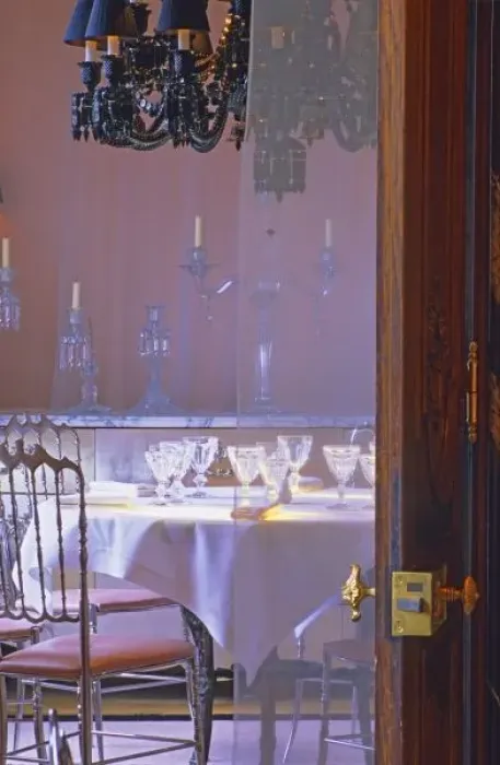 Framed Print : The private dining room with the black crystal chandelier seen through a door Framed Print : The private dining room with the black crystal chandelier seen through a door