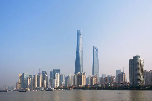 Pudong skyline dominated by Shanghai Tower by Huangpu River, Shanghai, China