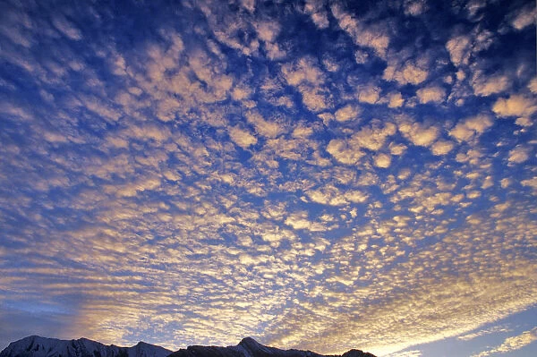 Puffy clouds at sunrise the Canadian Rockies in Banff National Park Alberta Canada