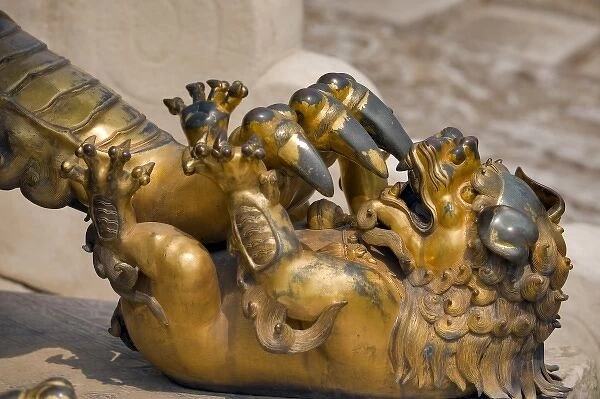 A Qing-era guardian lion with paw on baby lion, Forbidden City; Beijing; China, Asia