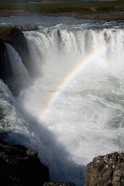 Rainbow formed in the mists of Godafoss Falls ( Falls of the Gods ). Here