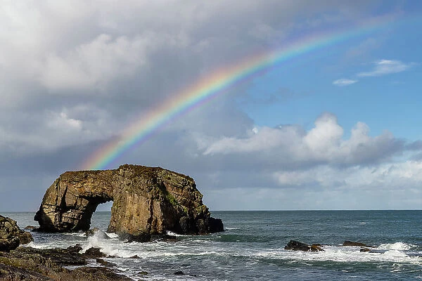 Rainbow over The Great Pollet Sea Arch in County Donegal, Ireland
