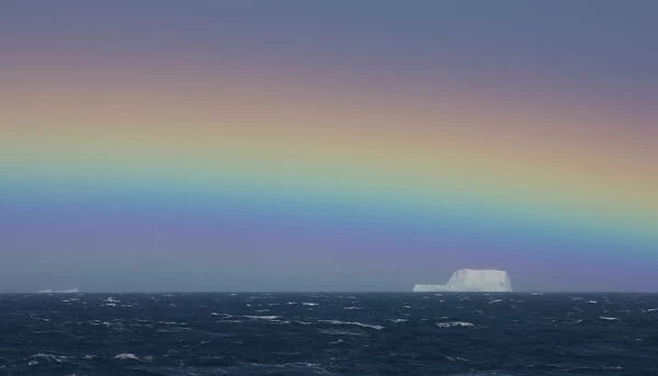 Rainbow over iceberg, South Georgia in the South Atlantic Ocean