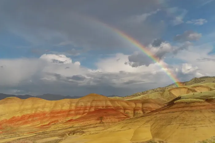 Framed Print : Rainbow and Stormy light over the Painted Hills at the John Day Fossil Beds National Monument near Mitchell, Oregon, USA