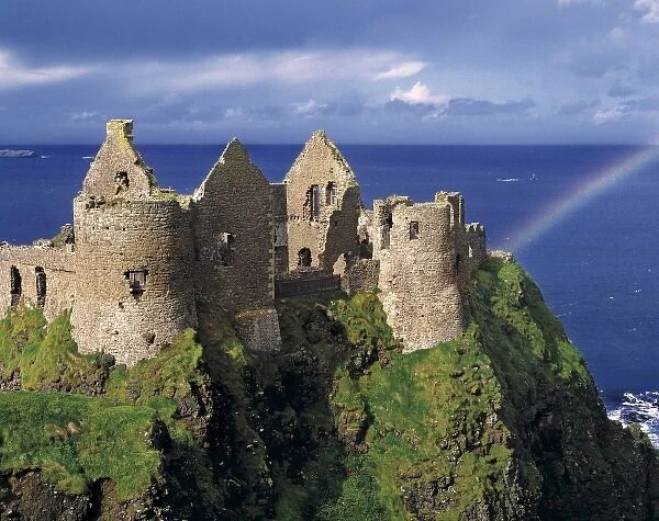 A rainbow strikes medieval Dunluce Castle on the Antrim Coast in Co. Antrim in Northern Ireland