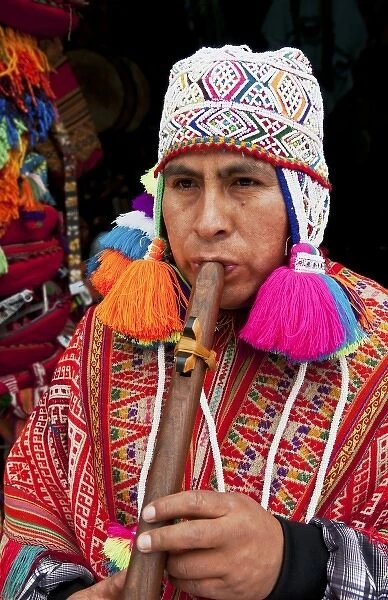 Real Shaman religious man playing music in small town of Pisaq Peru (MR)