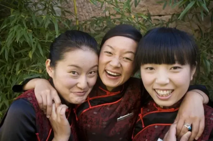 Framed Print : Reception girls in Naxi-style dress at spa resort, Jade Dragon Snow Mountain Valley outside Lijiang