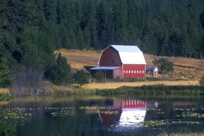 Framed Print : A red barn with sheet metal roof is reflected in a lake just north of Hayden Lake, Idaho Framed Print : A red barn with sheet metal roof is reflected in a lake just north of Hayden Lake, Idaho