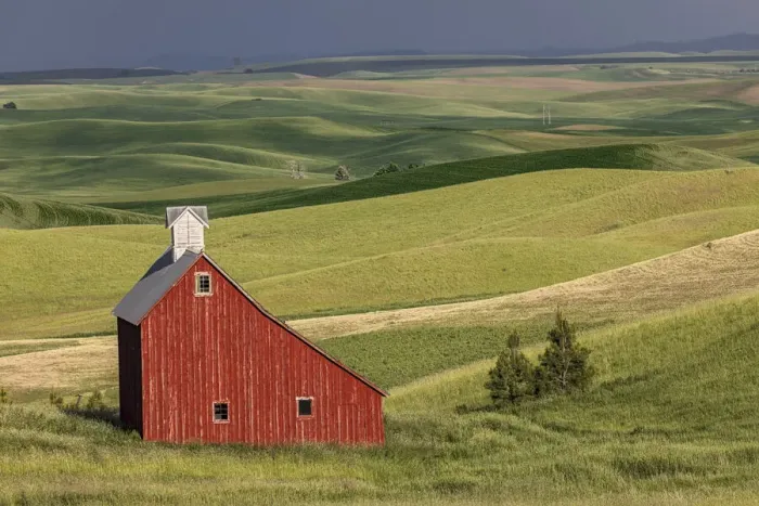Framed Print : Red barn in valley of rolling farm fields, Palouse agricultural region of western Idaho